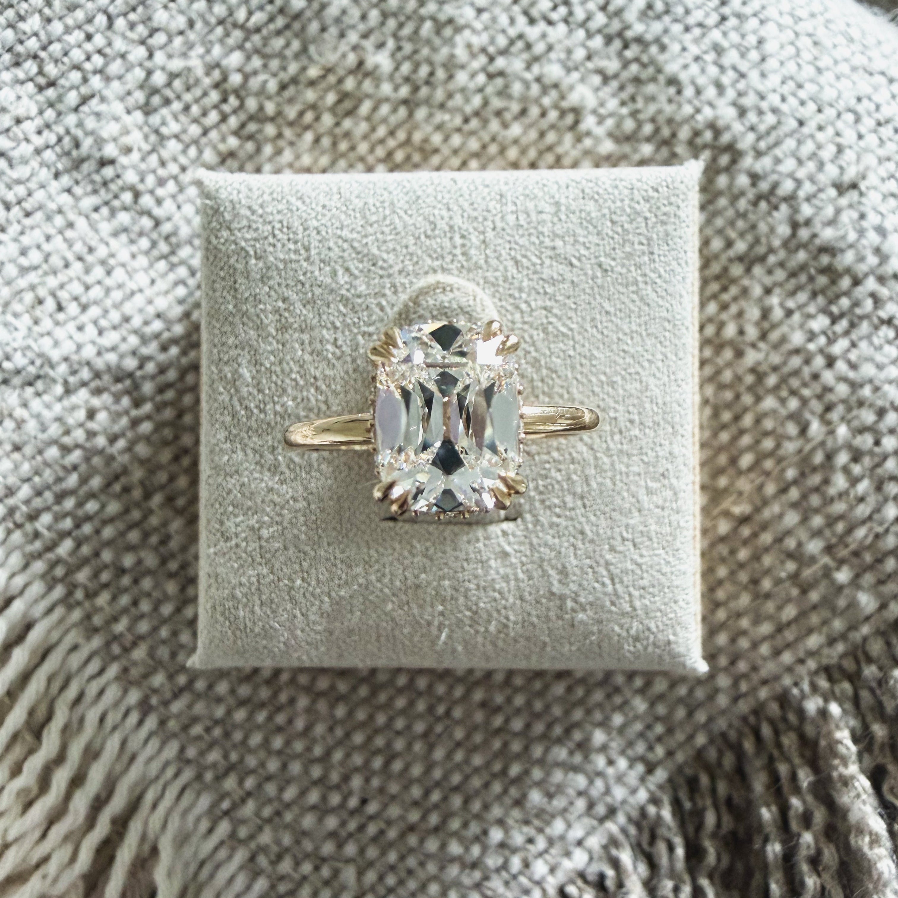 “The Georgia” | 2ct old mine cut diamond ring with peekaboo halo